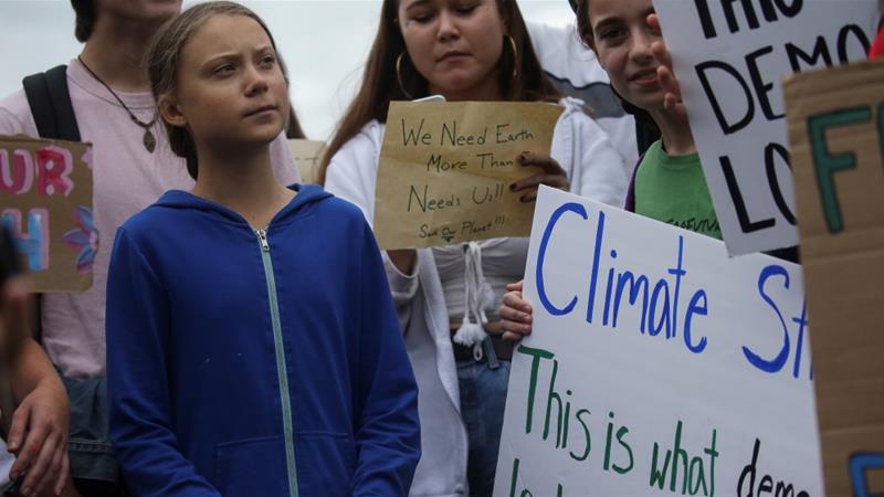 Teen climate activist Greta Thunberg and other environmental advocates join Washington, DC-area students at a rally on the Ellipse near the White House [Leah Millis/Reuters]