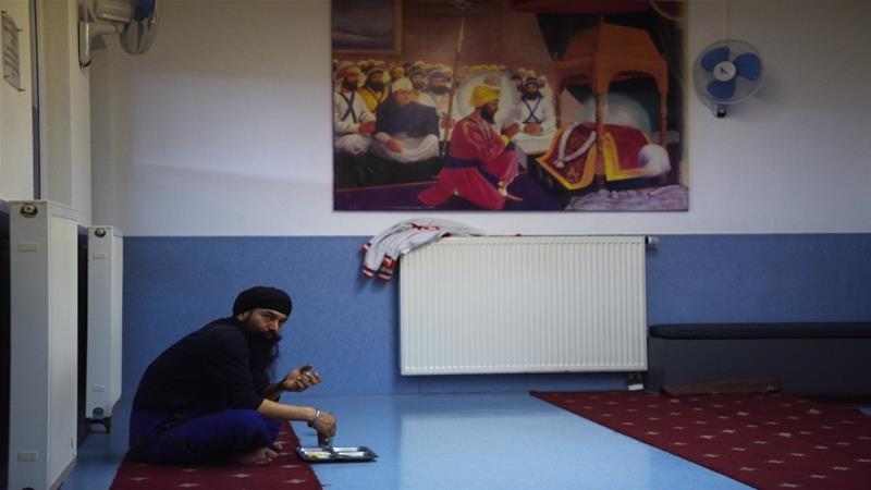 Members of the Sikh community centre in Essen, Western Germany eat on April 21, 2016 [File: Patrik Stollarz/AFP]