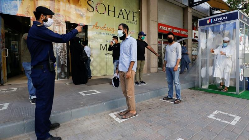 People in the Pakistani city of Karachi have started going to shopping malls again after they reopened following a Supreme Court order to do so [May 18, 2020: Akhtar Soomro/Reuters]