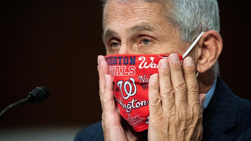 Anthony Fauci, director of the US National Institute of Allergy and Infectious Diseases, said he expects tens of millions of COVID-19 vaccine doses to be available by early 2021 [File: Al Drago/Pool via Reuters]