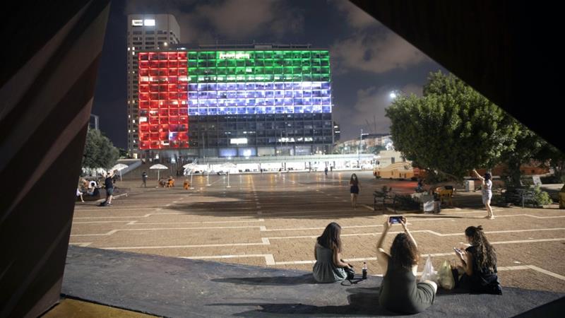 Tel Aviv City Hall is lit up in the colours of the UAE flag following the Gulf country's decision to establish full diplomatic ties with Israel, Tel Aviv, Israel, Aug 13, 2020 [AP Photo/Oded Balilty]