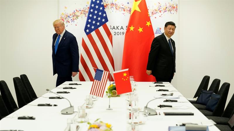 US President Donald Trump attends a bilateral meeting with Chinese President Xi Jinping during the G20 leaders' summit in Japan, 2019 [File: Kevin Lamarque/Reuters]