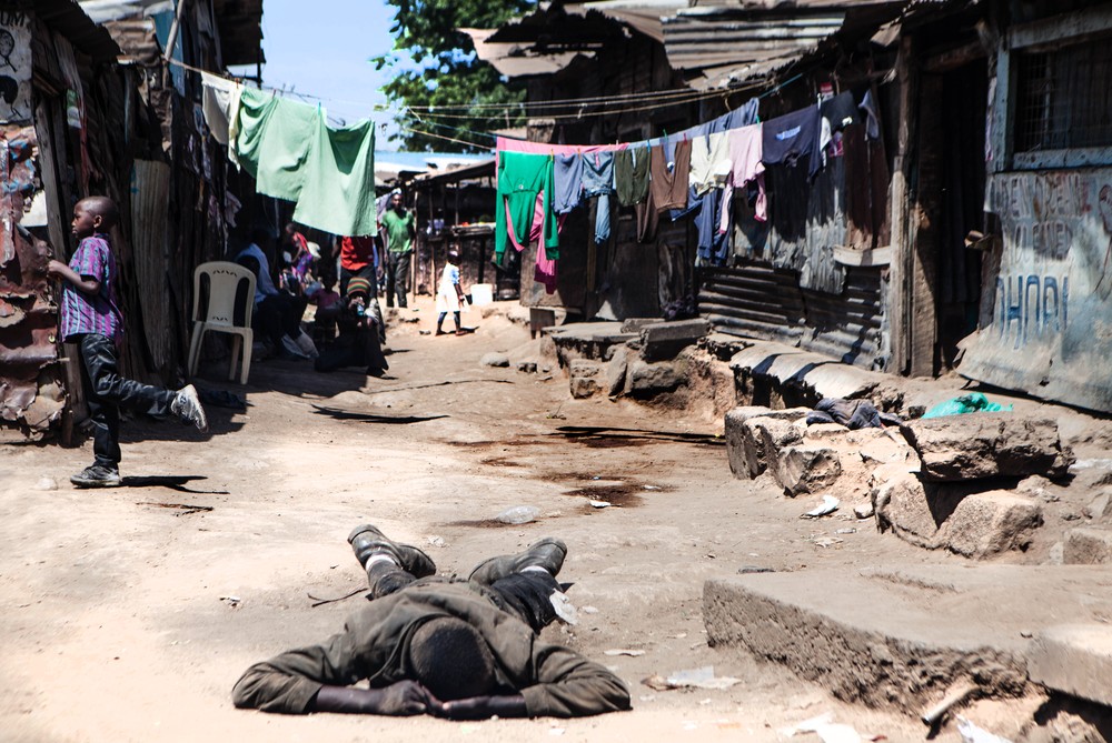 A common occurance in Mathare slum: lying semi-conscious in the middle of the street due to a heavy Changaa drinking session. 