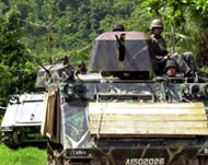 Filipino soldiers hunting rebels: But are they arming them too?