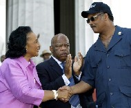 King's widow, Coretta Scott King greets veteran rights activist Jesse Jackson