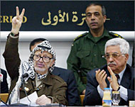 Arafat (L) appears to have won a power struggle with Abbas 