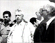 Ariel Sharon (C)  believes inusing military might  
