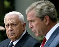 Israeli Premier Ariel Sharon (L) has avoided strong US criticism