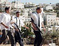 Jewish settlers are protected byhundreds of Israeli soldiers 