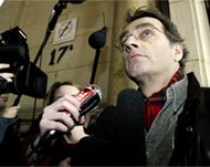 Photojournalist Jacques Langevinspeaks to the media in Paris