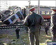 Russian NTV channel shows two policemen looking at the wreckage 