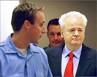 Milosevic (R), a prisoner at theHague, is running and could win