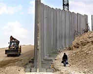 Critics say the apartheid wall's construction is blocking progress
