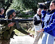
Israeli soldiers take aim atphoto-journalistsIsraeli soldiers take aim atphoto-journalists