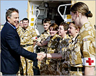 British PM Tony Blair (L) meetstroops in Iraq 