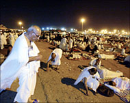 Pilgrims collect pebbles before proceeding for the stoning ritual  