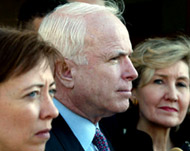 McCain (C) has said he does notbelieve Bush hyped Iraq's threat 