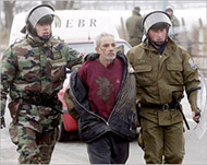 Policemen arrest a gypsy protestornear Trebisov 