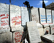 Palestinians say wall disrupts lifeand grabs parts of their land