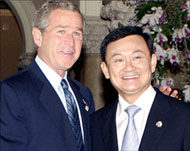 Thaksin (R) is likened to Bushin his ''interference'' in the south  