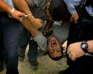 Israeli police arrest a settler after he attacked Palestinians