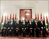 Jordan's King Abd Allah (C) with his new government last year