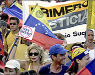 Opponents of President Hugo Chavez march in Caracas