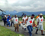 Red Cross, UN and multinational forces struggle to help survivors 