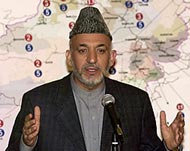 Violence and funds shortage mayyet derail Karzai's election plan