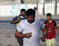 People ran for cover as fightingerupted on the streets of Najaf
