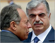 Prime Minister Hariri (R) opposesa second term for Lahud (L)