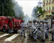 Police burst tear-gas shells andwater cannons to disperse mobs