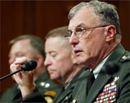 Major-General George Fay (C) cited Cruz's actions in a report  