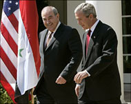 A US newspaper says Allawi (L)was coached by Bush officials