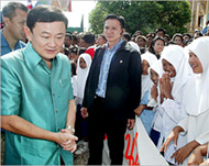 Thaksin (L) has taken charge of policy in southern Thailand