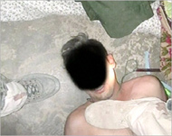 This photo showed a man on the floor with a boot to his chest 