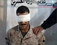 Aljazeera aired a tape showingHassun held by masked fighters