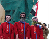 Blair, Saddam and Bush effigieswere in jail jumpsuits and nooses