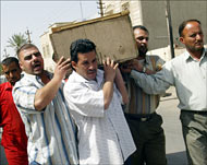Relatives carry al-Qaraghulli'scoffin after Monday night's attack