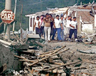 People walk among the rubble after an attack by Farc  in Cauca