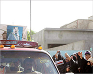 Iraqis bid farewell as the coffin ofNaif al-Jibouri is taken away