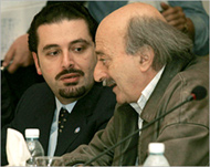 Saad al-Hariri's (L) group must win 21 seats for a full majority