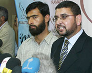 Hamas spokesman Sami Abu Zuhri(R) speaks in Gaza City 