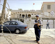 Iraqi security men guard the embassy of Bahrain in Baghdad