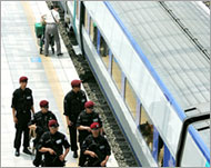 South Korean SWAT team membersstand guard next to a train in Seoul