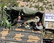 Syrian troops were pressed into pulling out from Lebanon in April 