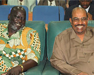 Garang (L) and President Omar al-Bashir (R) signed a peace deal