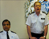 Police Commissioner Ian Blair (R)is under pressure to step down  