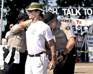 Sheriff's deputies arrest a pro-war demonstrator in Crawford