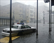 A New Orleans police car is abandoned in the raging storm  